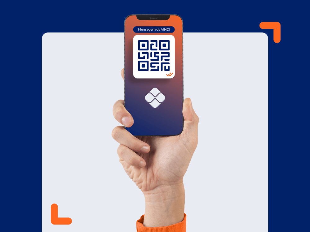 Pix Vindi: imagem com fundo azul escuro e mão segurando celular com QR Code e logomarca do PIX