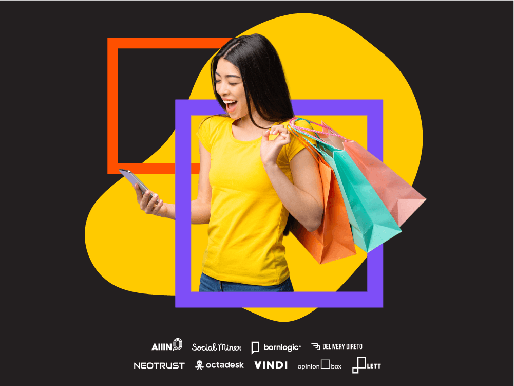 Dados Black Friday: imagem mostra mulher em fundo estilizado preto com amarelo e quadrados laranja e roxo. Ela está olhando para o celular e com 3 sacolas de compras na mão.