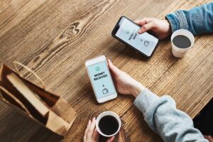 Money transfer. Online banking. People transferring money online using applications for send and receive money on smartphones. Friends making money transfers. Smartphone screen displaying money transfer confirmation. Digital wallet. Money exchange. Paying